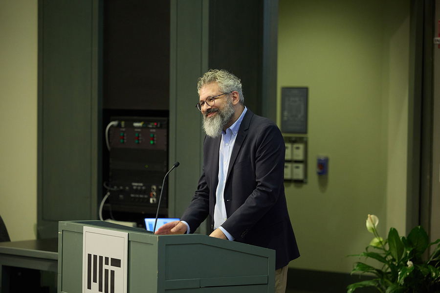 Keeril Makan speaks, standing behind a lectern.