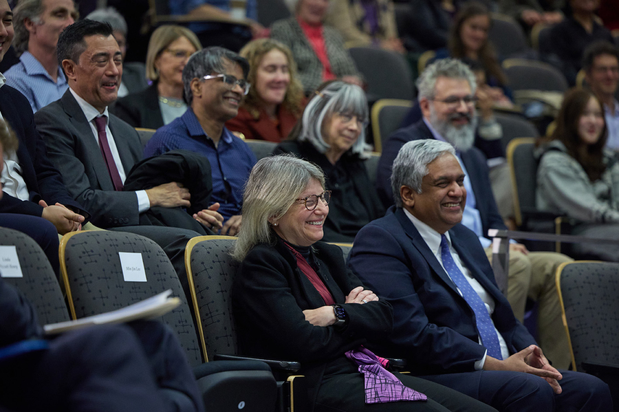 A group of people sitting in an audience.