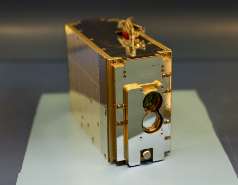 Photo of a small laser communications payload, about the size of a tissue box.