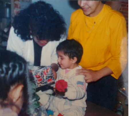 A baby wears an astronaut onesie.