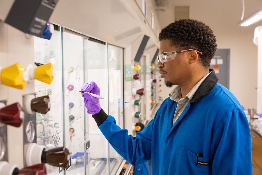 Gerard Porter wears protective clothing for his laboratory in chemistry.