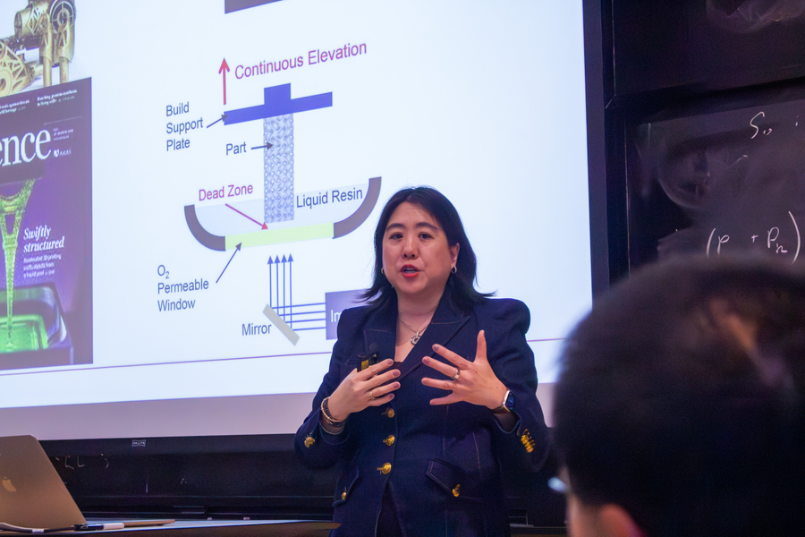 Vanessa Chan speaks in front of a screen in an MIT auditorium.