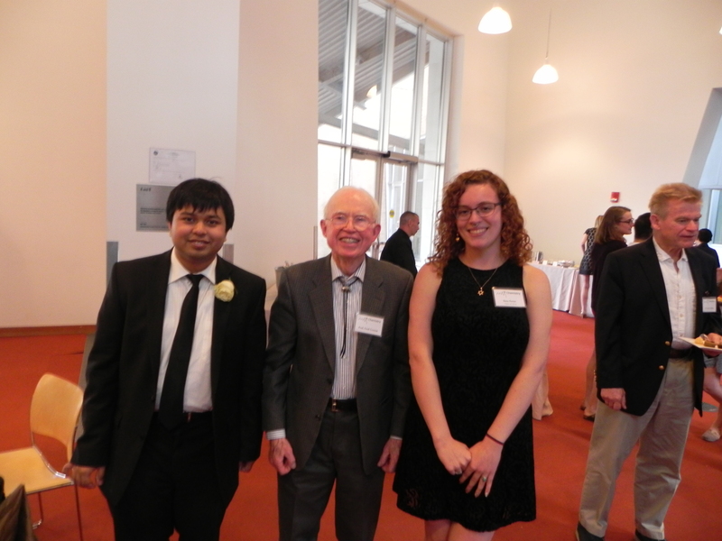 Fred Greene, Diptarka Hait, and Ilana Porter Molesky pose together in a reception hall