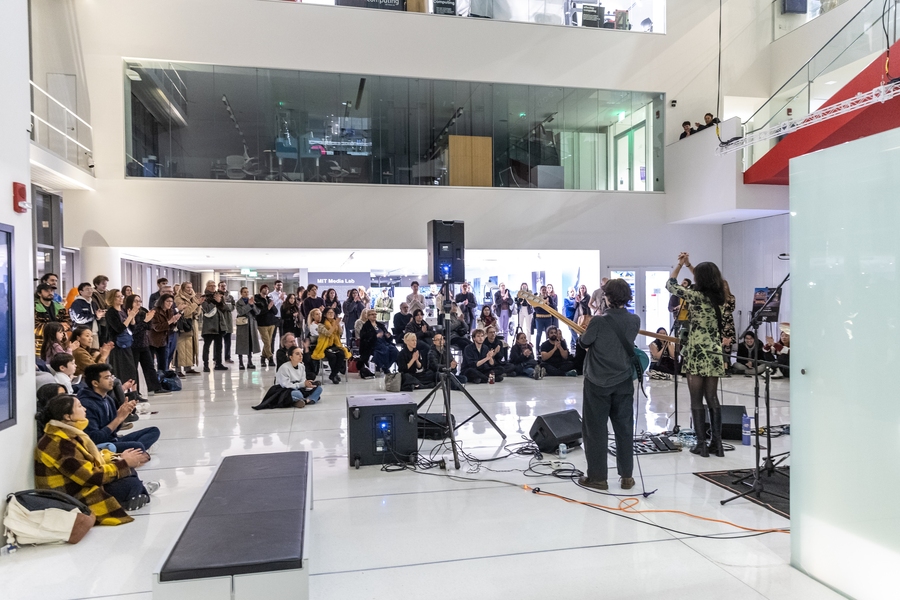 Musicians perform for a group