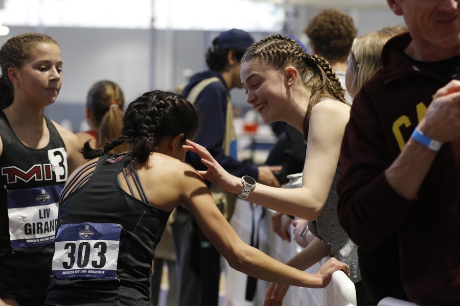 MIT runners supporting each other after a race