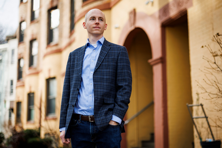 Christopher Palmer outside with MIT buildings in background.