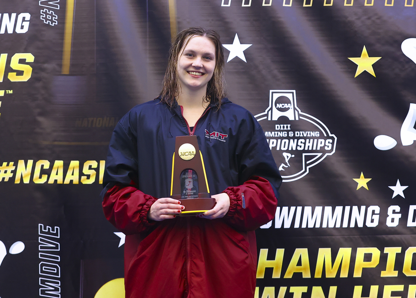 Kate Augustyn poses with a trophy