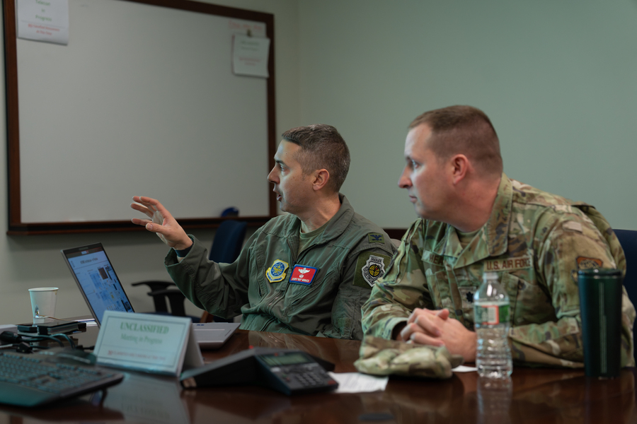 Colonel Joseph Monaco and Lieutenant Colonel Tim Heaton provide feedback to laboratory researchers