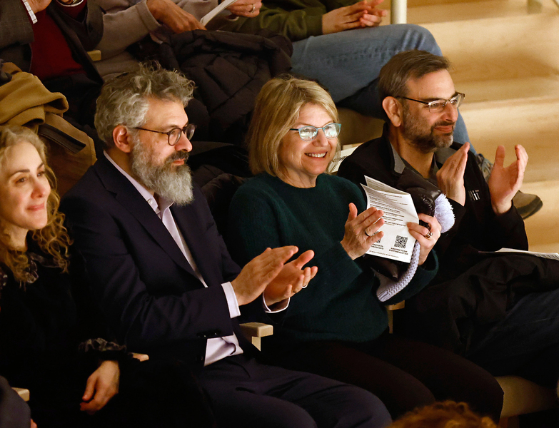 Keeril Makan, Sally Kornbluth, and Daniel Lew clap in audience at a performance