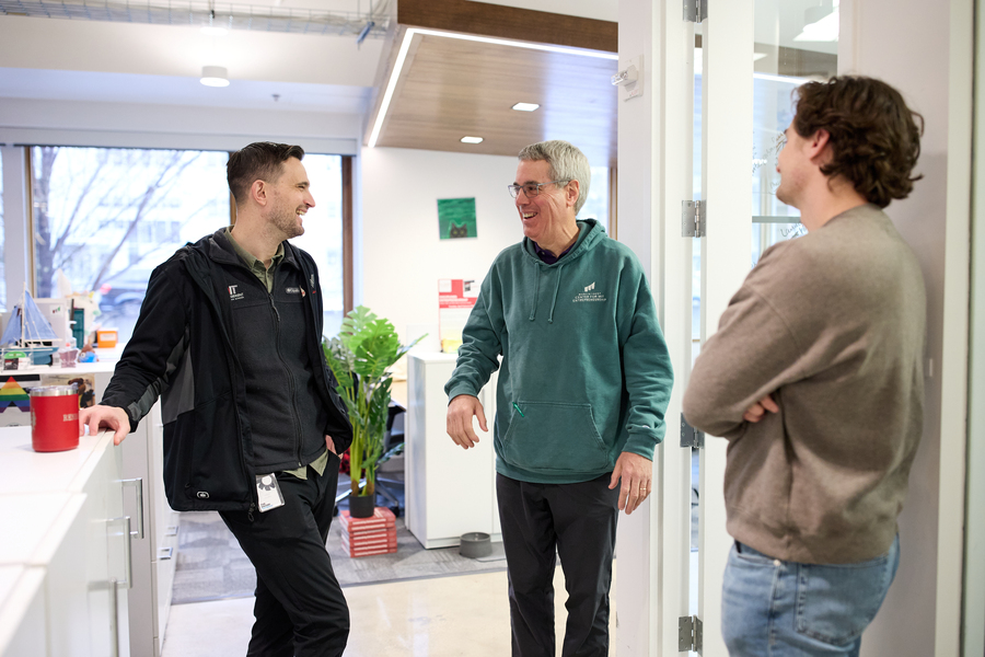 David Brown chats with two people at the Martin Trust Center