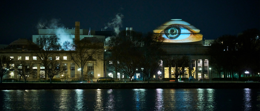 Projection of an eye on the dome of MIT at night