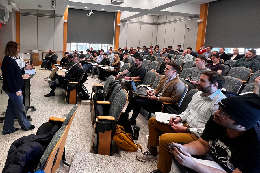 Dame Fiona Murray teaches to classroom.