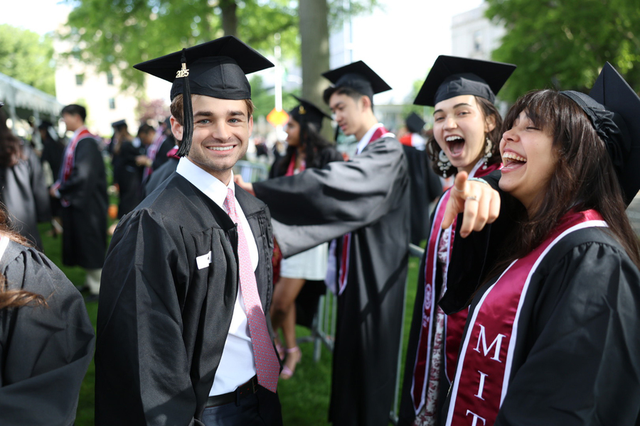 MIT students in graduation caps and gowns
