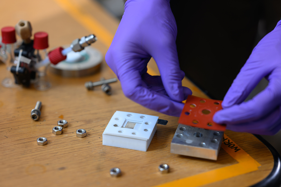 A researcher assembles flow cell prototype