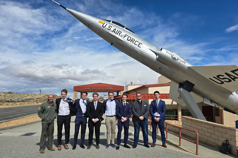 Students and U.S. Air Force Pilots standing near a U.S. Air Force jet