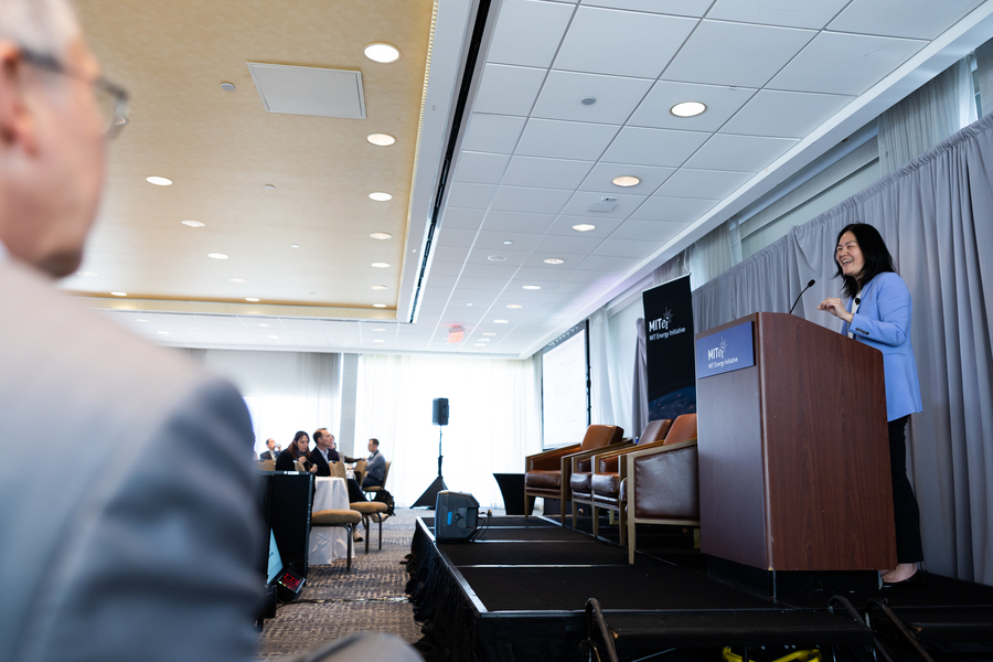 Evelyn Wang speaks at a lectern 