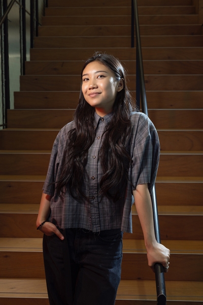 Ylana Lopez standing on a staircase