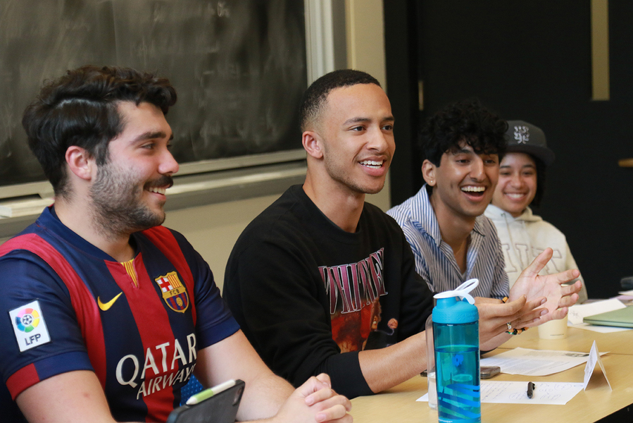 Xavier Banos, Kayode Dada, Siddhu Pachipala, and Gabbie Girard sit at a classroom table.
