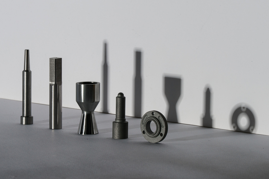 Five metal attachments for tools