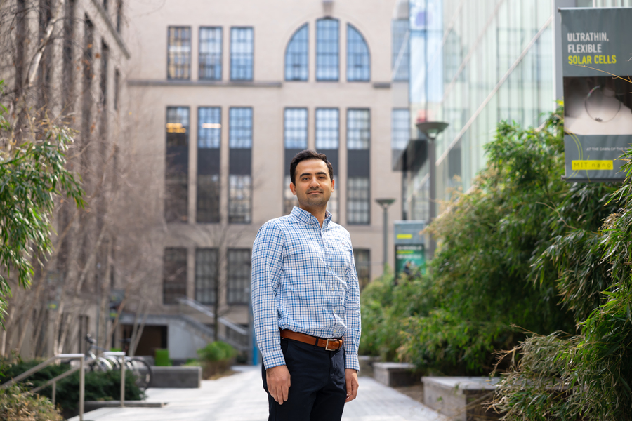 Soroush Araei stands in the MIT courtyard known as the "Improbability Walk"