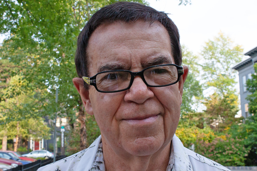 Keith Johnson headshot with trees and a house in the background