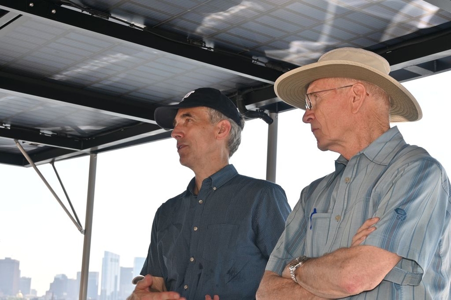 James Worden speaks as Kim Vandiver looks on, aboard the boat
