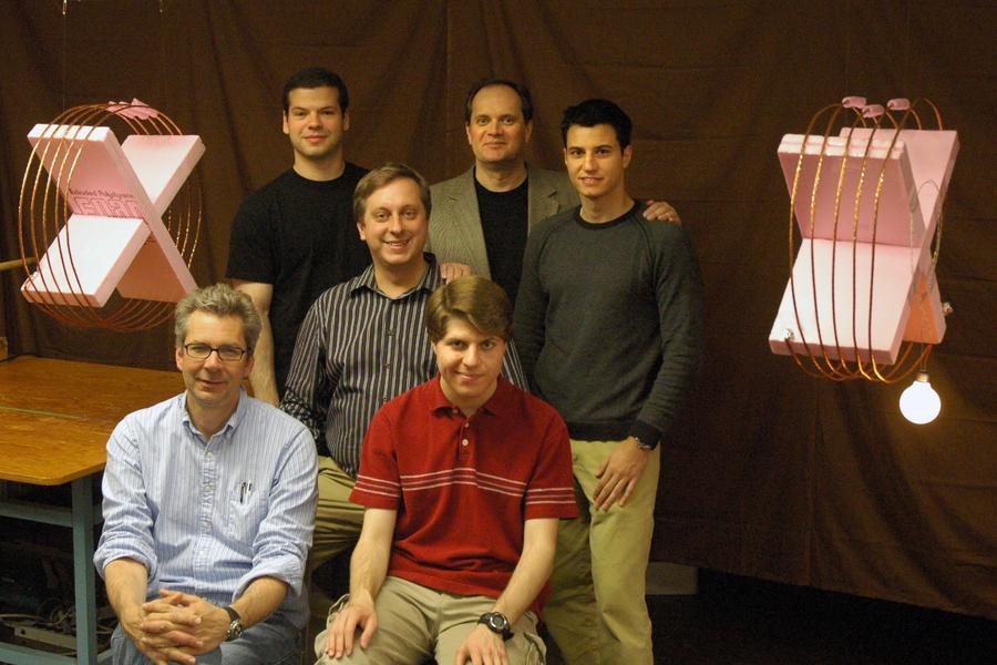 John Joannopoulos stands in back row in group photo with Peter Fisher, Robert Moffatt, Marin Soljacic, Andre Kurs, and Aristeidis Karalis.
