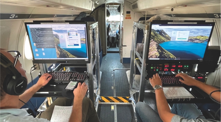 Onboard an aircraft, two console operators command an interface.