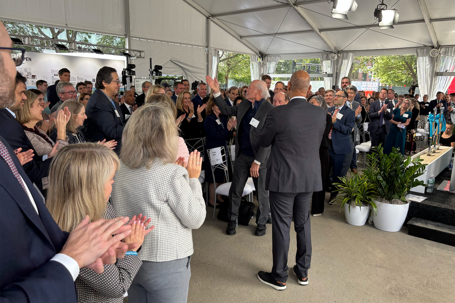 Professor Phillip Sharp acknowledges a standing ovation.