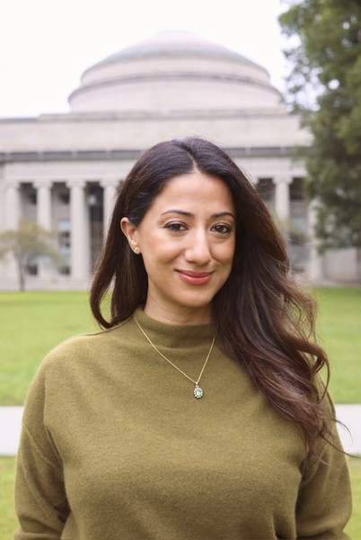 Ana Bakshi poses outside the MIT dome on a summer day