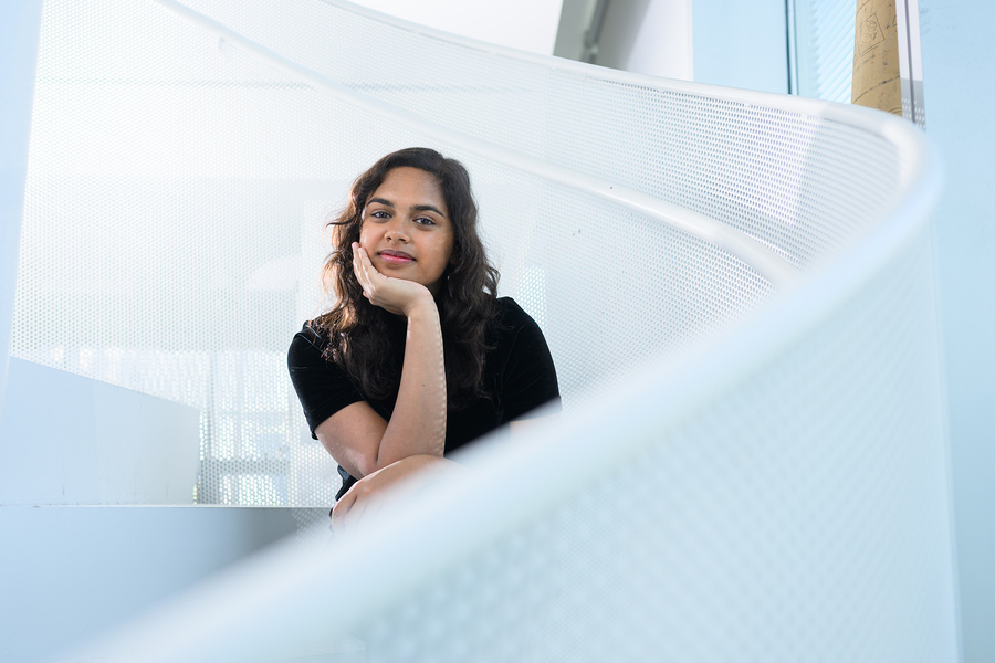 Portrait of Maya Lecamwasam on a white staircase