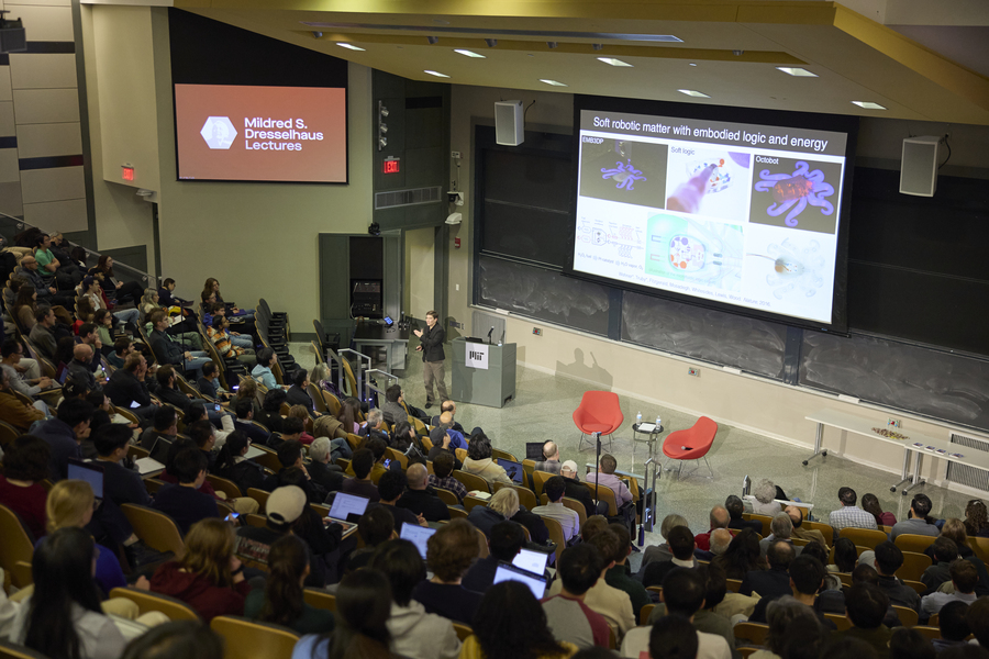Jennifer Lewis speaks to a lecture hall full of several hundred people.