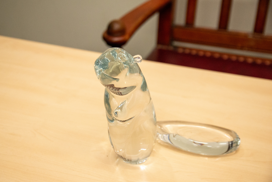 A close-up of a glass beaver on a tabletop