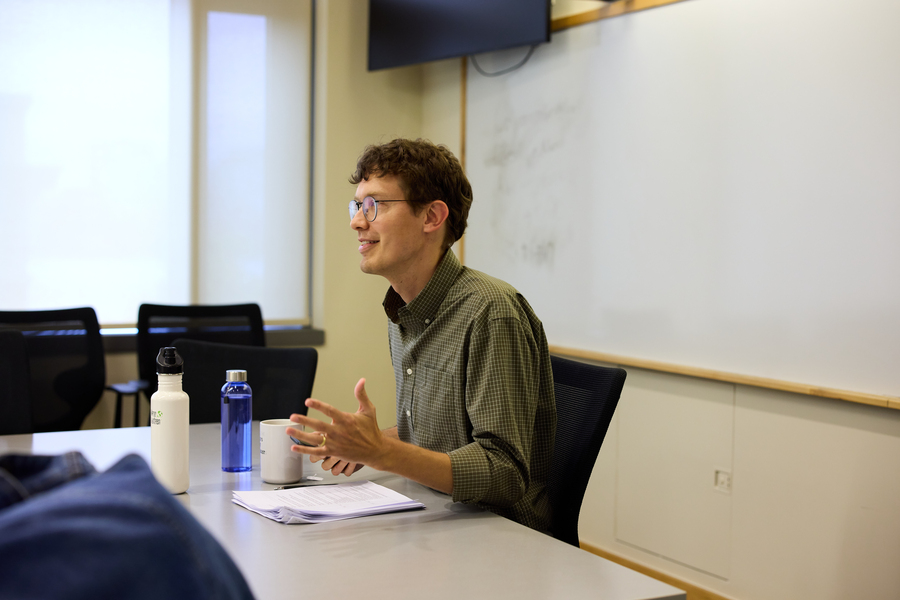 Nathan Wilmers sits in a classroom