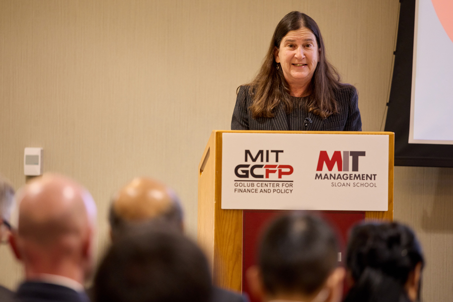 Deborah Lucas speaks at a podium.