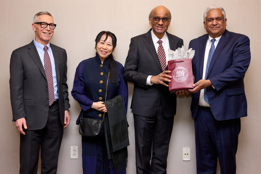 Locke, Tharman, Ittogi, and Chandrakasan stand together and smile.