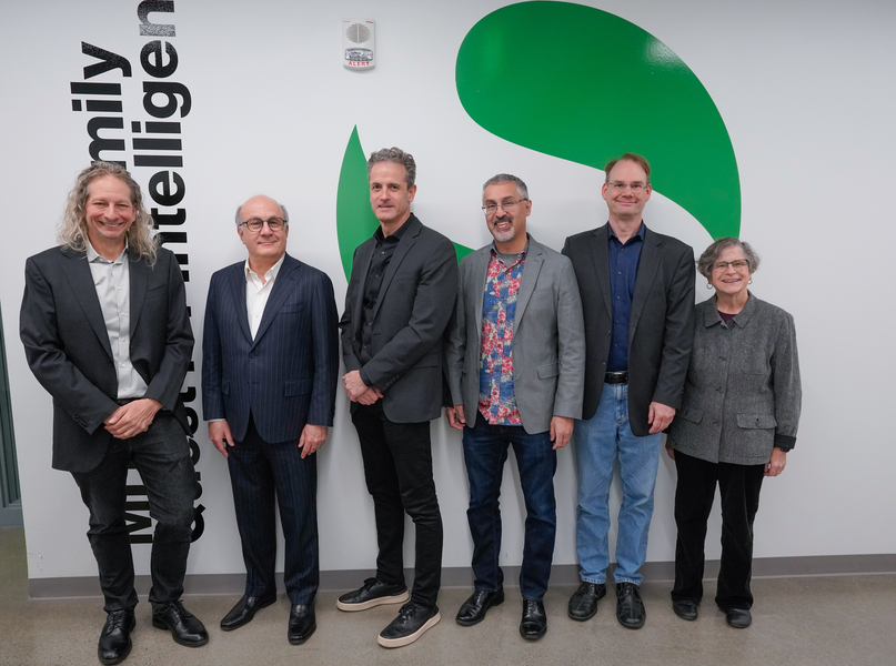 Josh Tenenbaum, David Siegel, Jim DiCarlo, Nick Roy, Erik Vogan, and Leslie Kaelbling stand along an indoor wall