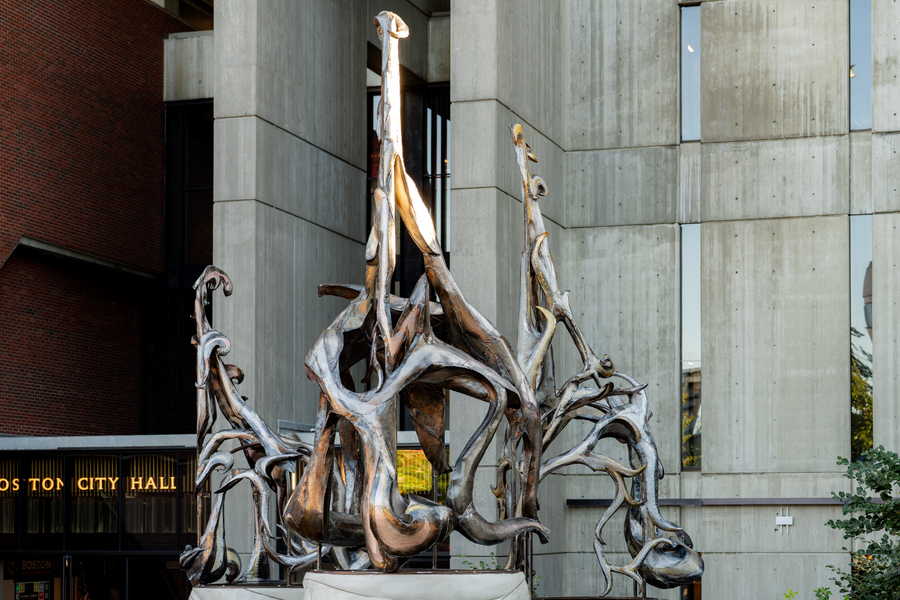 19-foot-tall metal sculpture “Amulet,” which looks a bit like knotted strands of natural fiber, stands before Boston City Hall.