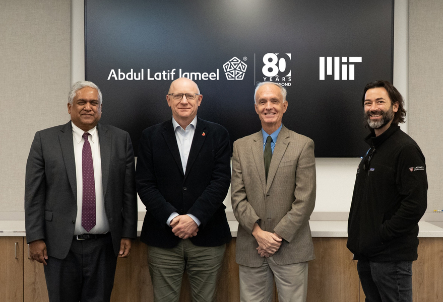 Anantha Chandrakasan, Bruce Currie, Jim Collins and Alex Shalek in front of a black screen displaying logos
