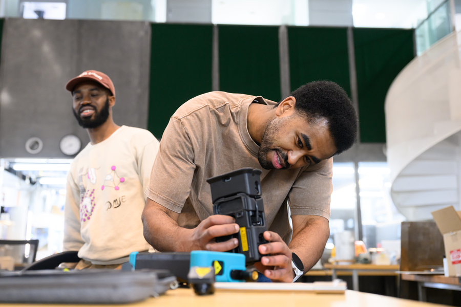 An attendee in a workshop on Raman spectroscopy works on the device setup.