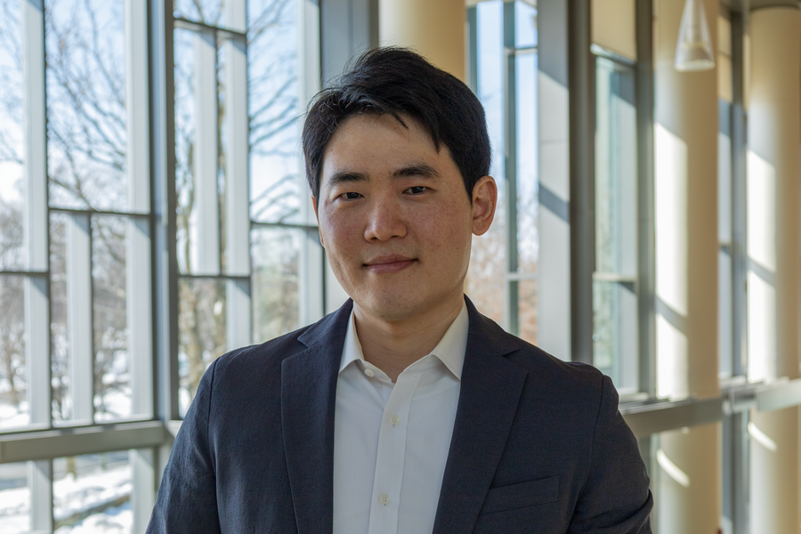Sojun Park poses in a sunlit corridor