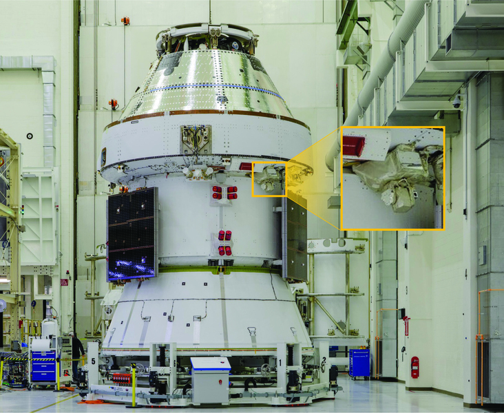 Photo of an Orion spacecraft inside a cleanroom. A callout box outlines where a laser communications terminal is on the spacecraft.