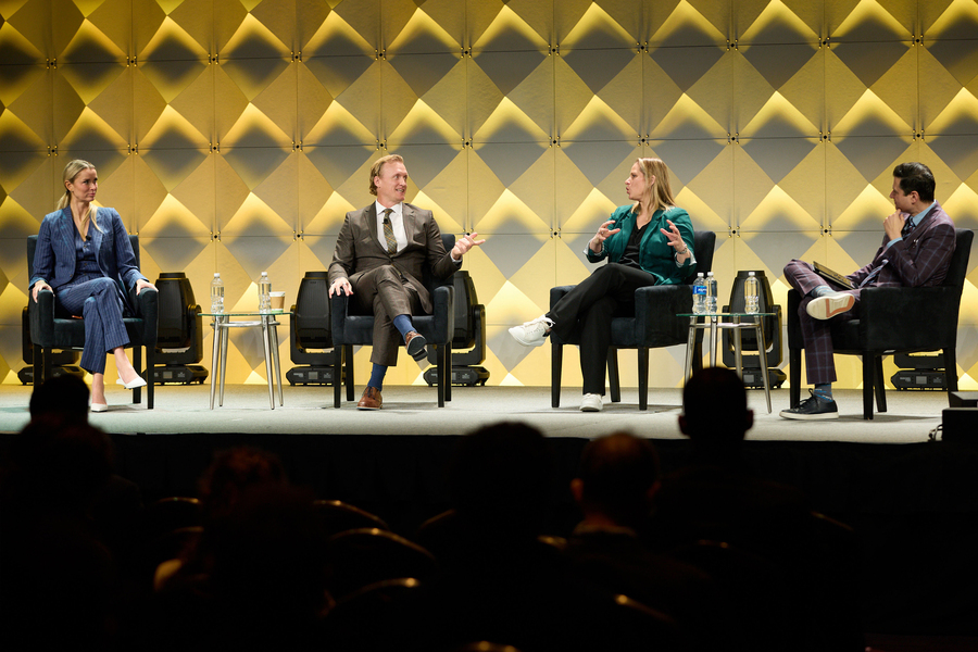 Meghan Chayka, John Wroblewski, Angela Ruggiero, and Arda Öcal on stage.