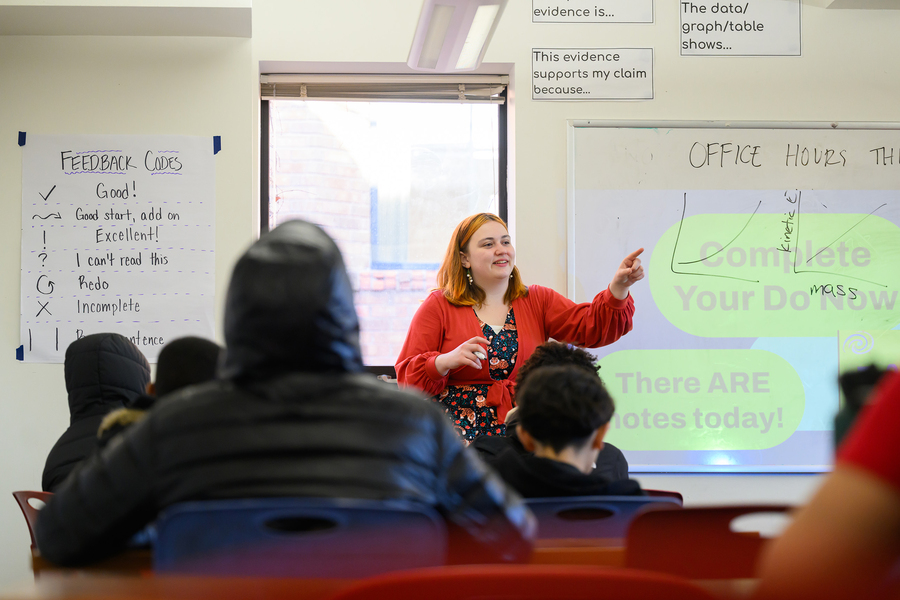 Nik Sandu stands in front of her seventh-grade class, pointing to a student