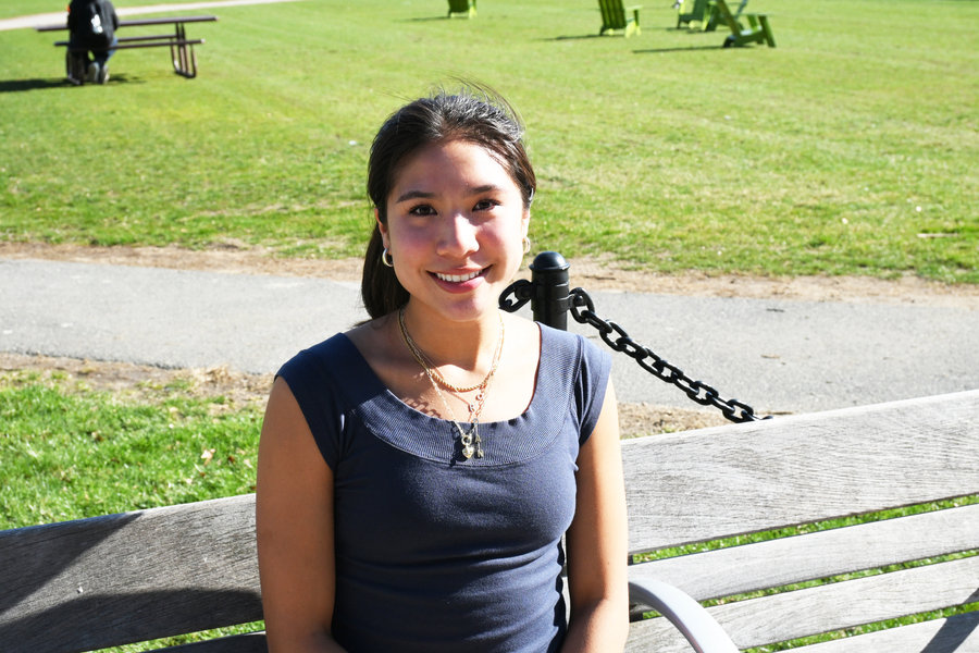 Photo of Jordan Lacsamana on an MIT green space