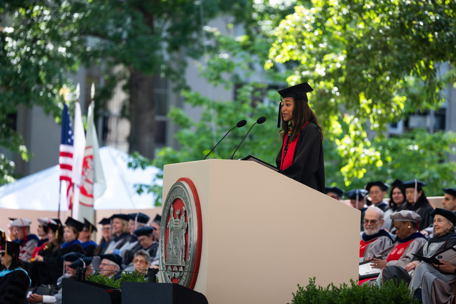 Heba Hussein speaks at podium during MIT commencement.