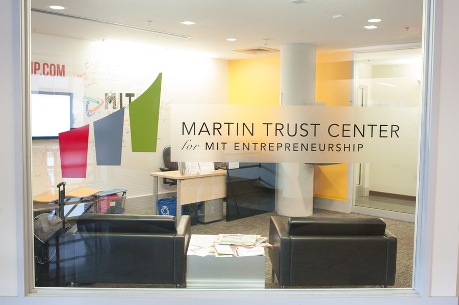 Window looking into the Martin Trust Center for MIT Entrepreneurship has those words etched onto the glass, with a logo.