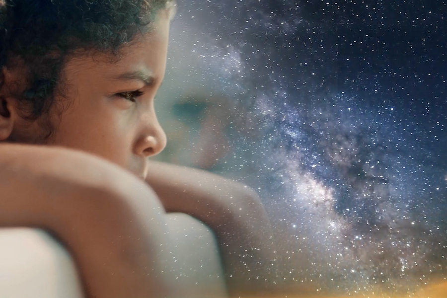 A child dreaming about the night sky