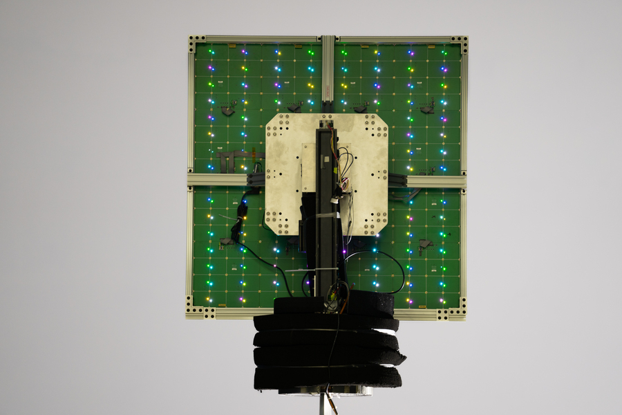 A scanning reflectarray antenna lights up with its individual reflective elements in a 16x16 grid.