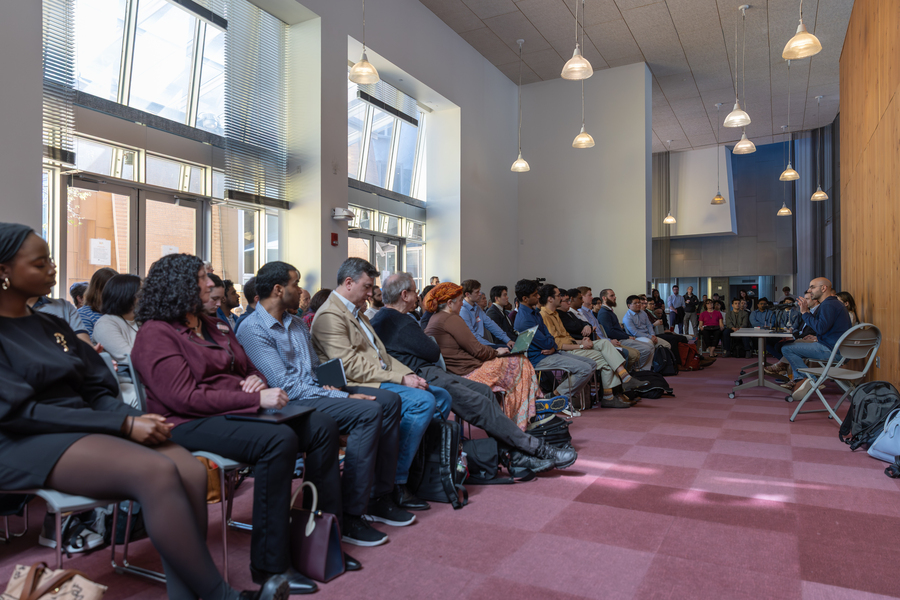 Scores of people attend a panel discussion